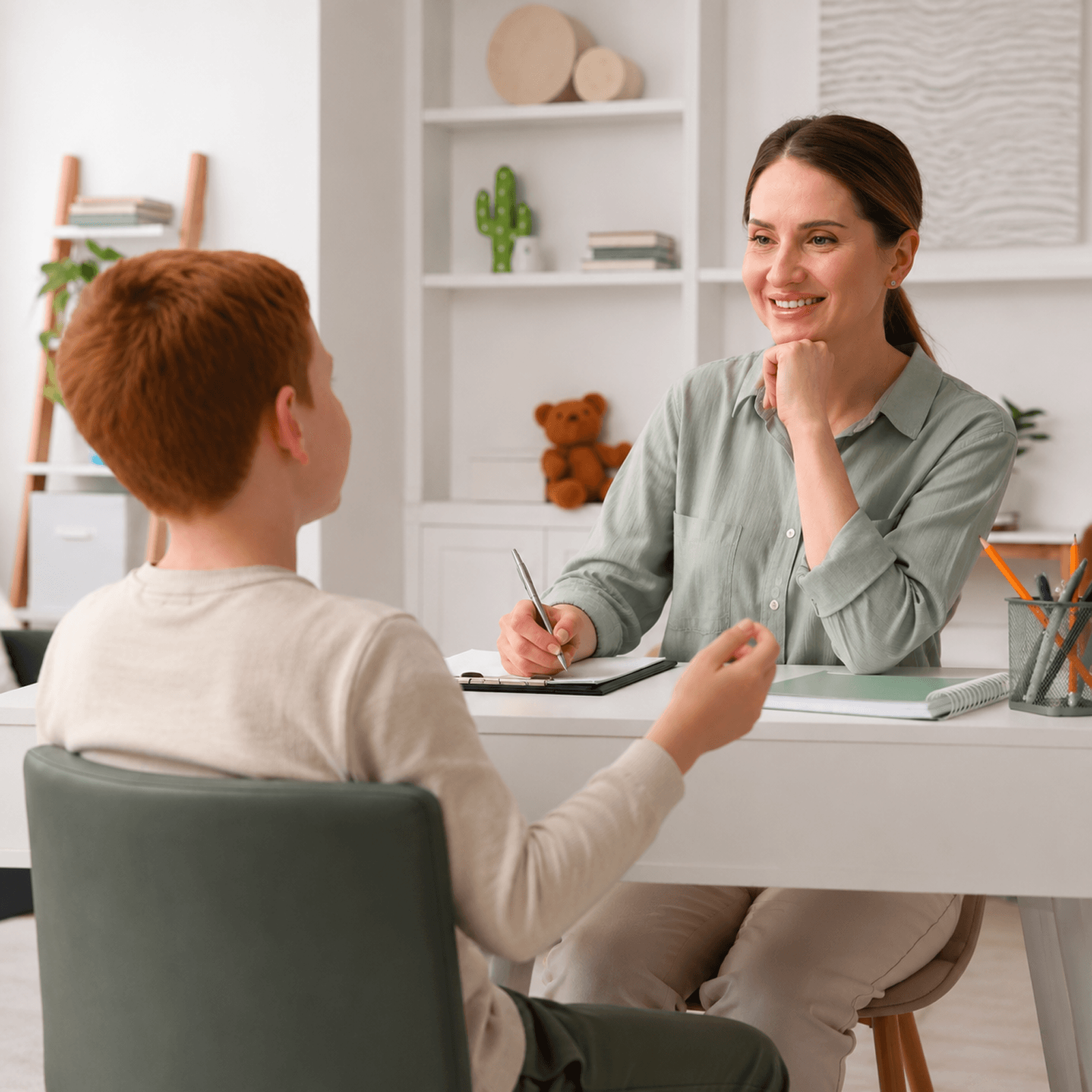 Behavior analyst observing and assessing a child